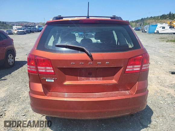 2013 Dodge Journey American Value z VIN 3C4PDCAB1DT656317, wystawiony jako Copart lot #58525885 z przebiegiem 210 834 mil mil oraz Szkoda całkowita • Salvage title. Historia ofert i sprzedaży dostępna na DreamBid. Obrazek 6.