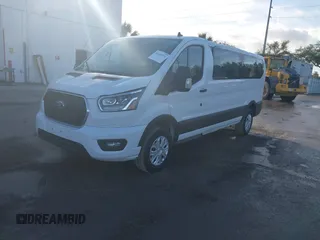 2023 Ford Transit Passenger XL with VIN 1FBAX2Y8XPKB33065, listed as a IAAI auction lot 41440531 with 21,155 mi miles and . Bid and sale history available at DreamBid. Image 2.