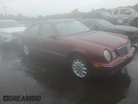 2002 Mercedes-Benz E 320 with VIN WDBJF82J22X070566, listed as a Copart auction lot 55964535 with 238,240 mi miles and Salvage Title. Bid and sale history available at DreamBid. Image 4.