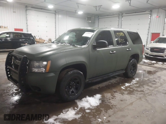 2014 Chevrolet Tahoe Commercial with VIN 1GNSK2E05ER196941, listed as a IAAI auction lot 41938892 with 176,170 mi miles and . Bid and sale history available at DreamBid. Image 2.