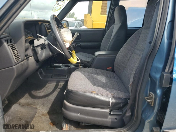 1999 Jeep Cherokee Sport with VIN 1J4FT68S6XL564281, listed as a Copart auction lot 72193874 with 0 mi miles and Salvage Title. Bid and sale history available at carsss.com. Image 7.