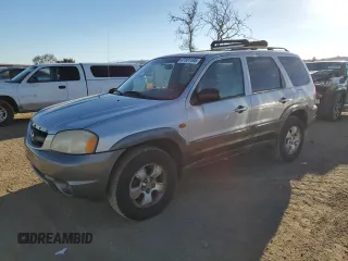2001 Mazda Tribute LX with VIN 4F2CU08111KM20113, listed as a Copart auction lot 87681195 with 144,400 mi miles and Salvage Title. Bid and sale history available at carsss.com. Image 1.