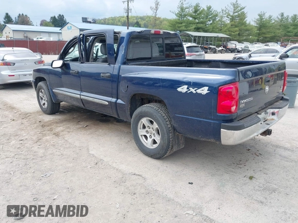 2005 Dodge Dakota Laramie with VIN 1D7HW58NX5S227633, listed as a IAAI auction lot 42122619 with 85,338 mi miles and . Bid and sale history available at DreamBid. Image 3.