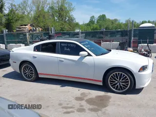 2014 Dodge Charger SE with VIN 2C3CDXBG2EH258886, listed as a IAAI auction lot 42104999 with 185,723 mi miles. Bid and sale history available at carsss.com. Image 13.