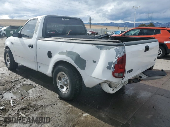 2002 Ford F-150 XL with VIN 1FTRF17212KC06180, listed as a Copart auction lot 45336625 with 214,139 mi miles and Salvage title. Bid and sale history available at DreamBid. Image 2.