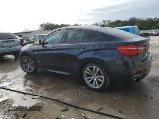 2015 BMW X6 xDrive50i with VIN 5UXKU6C56F0F93641, listed as a Copart auction lot 77233553 with 71,409 mi miles. Bid and sale history available at carsss.com. Image 2.