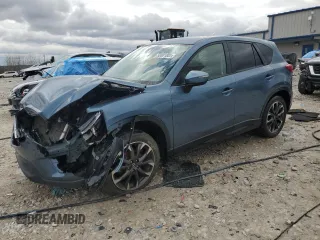2016 Mazda CX-5 Grand Touring z VIN JM3KE4DY2G0637779, wystawiony jako Copart lot #52001805 z przebiegiem 184 381 mil mil oraz Czysty tytuł • Clean title. Historia ofert i sprzedaży dostępna na DreamBid. Obrazek 1.