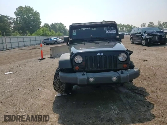 2012 Jeep Wrangler Unlimited Sport with VIN 1C4BJWDG8CL116811, listed as a Copart auction lot 59372085 with 95,498 mi miles and Salvage title. Bid and sale history available at DreamBid. Image 13.