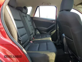 2014 Mazda CX-5 Touring with VIN JM3KE2CY0E0309845, listed as a Copart auction lot 62193734 with 97,878 mi miles and Salvage Title. Bid and sale history available at carsss.com. Image 11.