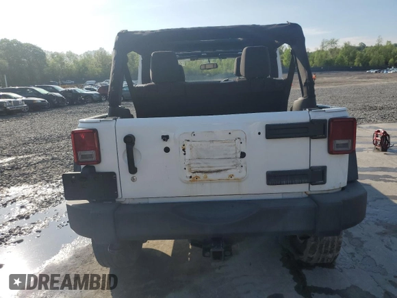 2013 Jeep Wrangler Unlimited Sport z VIN 1C4BJWDG3DL701619, wystawiony jako Copart lot #55880055 z przebiegiem Nie podano mil oraz Szkoda całkowita • Salvage title. Historia ofert i sprzedaży dostępna na DreamBid. Obrazek 6.