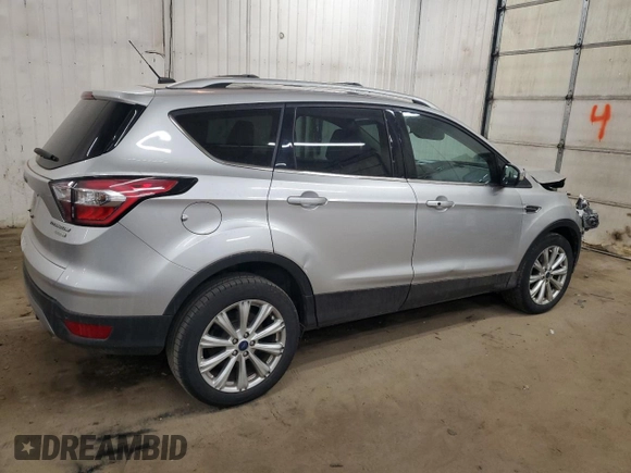 2017 Ford Escape Titanium with VIN 1FMCU0JD6HUE70200, listed as a Copart auction lot 49141595 with 92,159 mi miles and Salvage Title. Bid and sale history available at DreamBid. Image 3.