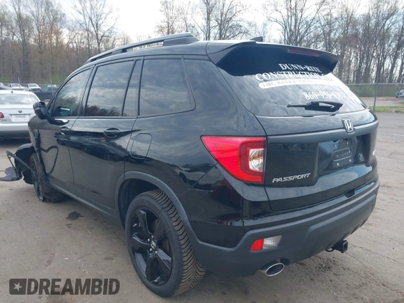 2019 Honda Passport EX-L with VIN 5FNYF8H5XKB024116, listed as a IAAI auction lot 42055543 with 68,641 mi miles and . Bid and sale history available at DreamBid. Image 3.
