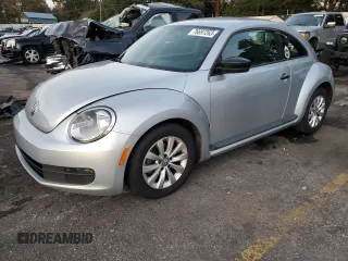 2013 Volkswagen Beetle Entry with VIN 3VWFP7AT3DM670214, listed as a Copart auction lot 76697263 with 121,359 mi miles and Salvage title. Bid and sale history available at DreamBid. Image 1.