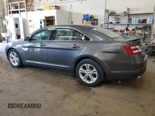 2015 Ford Taurus SEL with VIN 1FAHP2E84FG102318, listed as a Copart auction lot 61744685 with 82,149 mi miles and Salvage title. Bid and sale history available at DreamBid. Image 2.