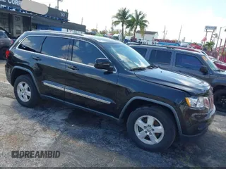 2012 Jeep Grand Cherokee Laredo with VIN 1C4RJFAG1CC119021, listed as a IAAI auction lot 41930537 with 86,729 mi miles. Bid and sale history available at carsss.com. Image 1.