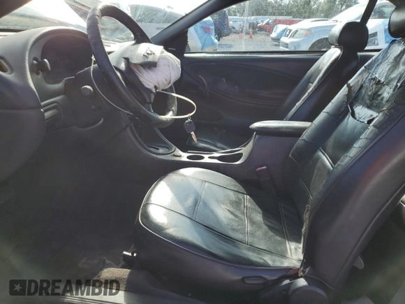 2002 Ford Mustang Deluxe with VIN 1FAFP44492F121223, listed as a Copart auction lot 62474065 with 128,984 mi miles and Salvage title. Bid and sale history available at DreamBid. Image 7.