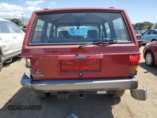 1992 Jeep Cherokee with VIN 1J4FJ58S0NL140995, listed as a Copart auction lot 56705875 with 253,657 mi miles and Salvage title. Bid and sale history available at DreamBid. Image 6.