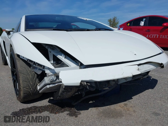 2009 Lamborghini Gallardo z VIN ZHWGU54T59LA07777, wystawiony jako IAAI lot #39749159 z przebiegiem 8730 mil mil oraz . Historia ofert i sprzedaży dostępna na DreamBid. Obrazek 20.