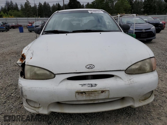 1999 Hyundai Accent with VIN KMHVD14N9XU503210, listed as a Copart auction lot 56486325 with 195,501 mi miles and Salvage title. Bid and sale history available at DreamBid. Image 5.