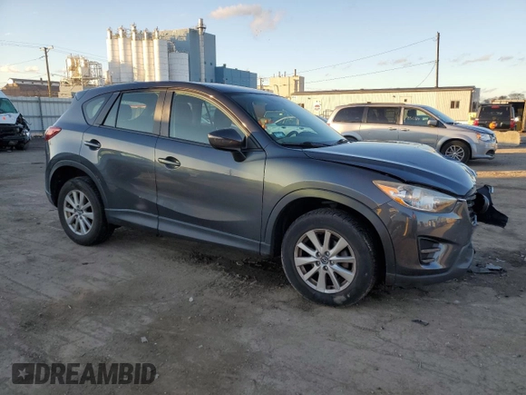 2016 Mazda CX-5 Sport with VIN JM3KE2BY9G0771969, listed as a Copart auction lot 80966064 with 99,348 mi miles and Salvage title. Bid and sale history available at DreamBid. Image 4.