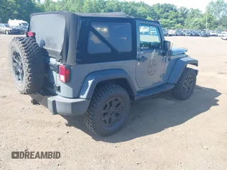 2015 Jeep Wrangler Freedom Edition with VIN 1C4AJWAG1FL714002, listed as a IAAI auction lot 42579024 with 98,732 mi miles and . Bid and sale history available at DreamBid. Image 4.