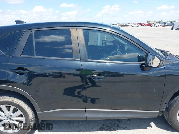 2014 Mazda CX-5 Sport with VIN JM3KE2BE9E0402015, listed as a IAAI auction lot 42098197 with 65,328 mi miles and . Bid and sale history available at carsss.com. Image 14.