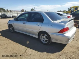 2003 Mitsubishi Lancer OZ-Rally with VIN JA3AJ86E43U048700, listed as a Copart auction lot 73719154 with 178,121 mi miles and Salvage Title. Bid and sale history available at carsss.com. Image 2.
