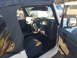 2004 Jeep Wrangler Sport Right Hand Drive with VIN 1J4F449S74P732854, listed as a IAAI auction lot 41408316 with 112,064 mi miles. Bid and sale history available at carsss.com. Image 5.