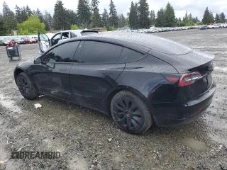 2023 Tesla Model 3 with VIN 5YJ3E1EA2PF457667, listed as a Copart auction lot 57360035 with 53,962 mi miles and Salvage title. Bid and sale history available at DreamBid. Image 2.