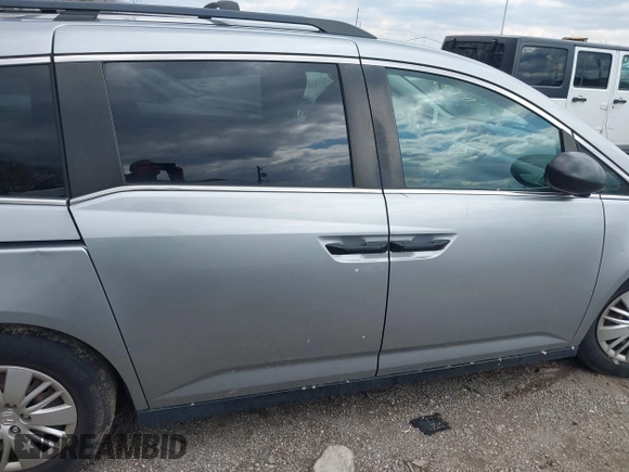 2016 Honda Odyssey LX with VIN 5FNRL5H23GB028338, listed as a IAAI auction lot 41980064 with 186,403 mi miles and . Bid and sale history available at DreamBid. Image 13.