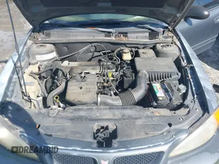 2004 Pontiac Grand Am SE1 z VIN 1G2NF52F04M513755, wystawiony jako IAAI lot #41600613 z przebiegiem Nie podano mil oraz . Historia ofert i sprzedaży dostępna na DreamBid. Obrazek 10.