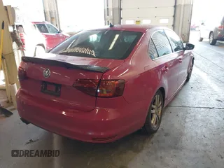 2012 Volkswagen Jetta Sedan TDI w/Premium & Nav with VIN 3VWLL7AJ6CM472769, listed as a IAAI auction lot 41026223 with 111,233 mi miles. Bid and sale history available at carsss.com. Image 4.