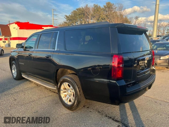 2015 Chevrolet Suburban with VIN 1GNSKHEC4FR25217, listed as a Copart auction lot 65346775 with 213,363 mi miles and Clean title. Bid and sale history available at DreamBid. Image 3.