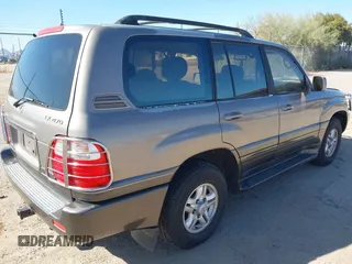 2000 Lexus LX 470 with VIN JT6HT00WXY0079873, listed as a IAAI auction lot 41605770 with 302,758 mi miles and . Bid and sale history available at DreamBid. Image 4.