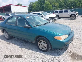 1997 Ford Escort LX with VIN 1FALP13P8VW184766, listed as a IAAI auction lot 40039873 with 104,604 mi miles. Bid and sale history available at carsss.com. Image 1.