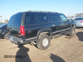 1999 GMC Suburban with VIN 3GKEC16R7XG527908, listed as a IAAI auction lot 41657788 with 216,894 mi miles. Bid and sale history available at carsss.com. Image 4.