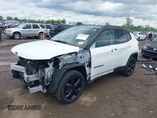 2021 Jeep Compass Altitude with VIN 3C4NJDBBXMT586529, listed as a IAAI auction lot 42296016 with 71,789 mi miles and . Bid and sale history available at DreamBid. Image 2.