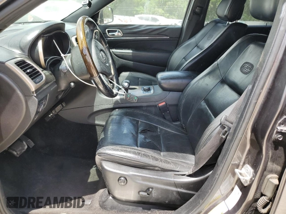2014 Jeep Grand Cherokee Overland with VIN 1C4RJFCT7EC182234, listed as a Copart auction lot 54754465 with 185,658 mi miles and Salvage Title. Bid and sale history available at DreamBid. Image 7.
