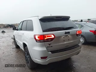2018 Jeep Grand Cherokee Altitude with VIN 1C4RJFAG4JC320599, listed as a IAAI auction lot 42182661 with 70,957 mi miles and . Bid and sale history available at DreamBid. Image 3.