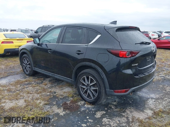2018 Mazda CX-5 Touring with VIN JM3KFACM0J0315739, listed as a IAAI auction lot 40516262 with 60,727 mi miles. Bid and sale history available at carsss.com. Image 3.