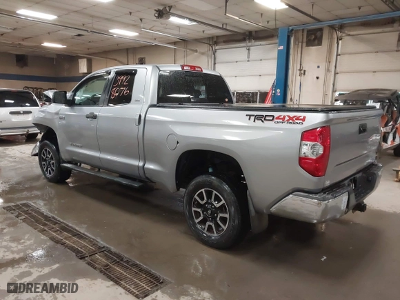 2014 Toyota Tundra 4WD Truck SR with VIN 5TFUY5F17EX357035, listed as a IAAI auction lot 39928076 with 129,831 mi miles. Bid and sale history available at carsss.com. Image 3.