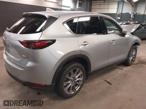 2021 Mazda CX-5 Grand Touring with VIN JM3KFBDM7M1392644, listed as a IAAI auction lot 41824612 with 80,000 mi miles and . Bid and sale history available at DreamBid. Image 4.