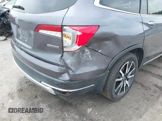 2019 Honda Pilot Touring 8-Passenger with VIN 5FNYF5H93KB028641, listed as a IAAI auction lot 42524078 with 56,744 mi miles and . Bid and sale history available at DreamBid. Image 19.
