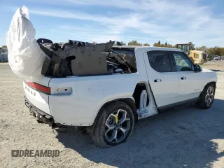 2024 Rivian R1T Adventure z VIN 7FCTGCAA9RN030318, wystawiony jako Copart lot #77036474 z przebiegiem 3 522 mil mil oraz Szkoda całkowita • Salvage title. Historia ofert i sprzedaży dostępna na DreamBid. Obrazek 3.
