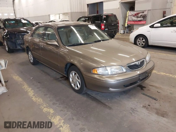 1999 Mazda 626 ES with VIN 1YVGF22C1X5852798, listed as a IAAI auction lot 41736489 with 136,536 mi miles. Bid and sale history available at carsss.com. Image 1.
