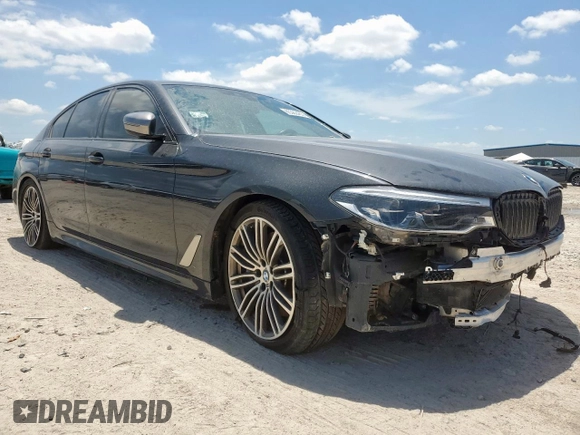 2019 BMW 5 Series M550i xDrive with VIN WBAJB9C51KB287797, listed as a Copart auction lot 65382465 with 61,459 mi miles and Salvage title. Bid and sale history available at DreamBid. Image 4.