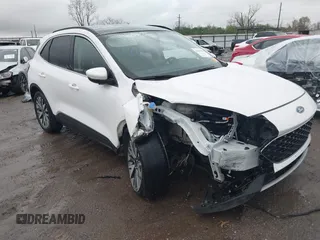 2020 Ford Escape Titanium z VIN 1FMCU9J98LUA35056, wystawiony jako IAAI lot #41949439 z przebiegiem 109 692 mil mil oraz . Historia ofert i sprzedaży dostępna na DreamBid. Obrazek 1.
