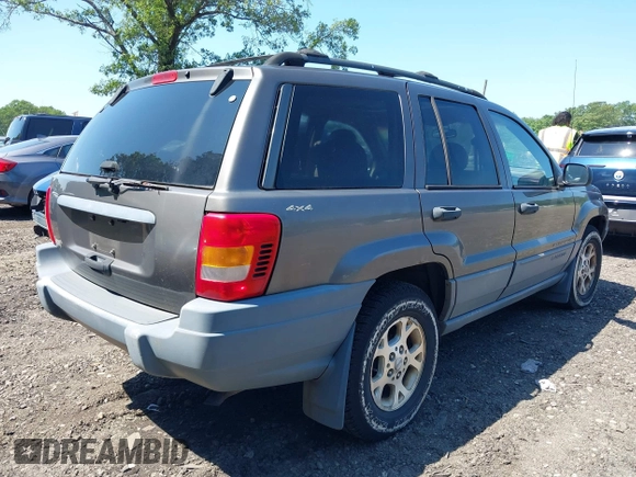2000 Jeep Grand Cherokee Laredo with VIN 1J4GW48S8YC380039, listed as a IAAI auction lot 42510307 with 215,776 mi miles and . Bid and sale history available at DreamBid. Image 4.