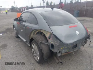 2013 Volkswagen Beetle 2.5L with VIN 3VWJP7AT6DM667477, listed as a IAAI auction lot 42215545 with 87,392 mi miles and . Bid and sale history available at DreamBid. Image 3.