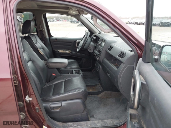 2014 Honda Ridgeline RTL with VIN 5FPYK1F52EB010700, listed as a IAAI auction lot 41490401 with 180,947 mi miles. Bid and sale history available at carsss.com. Image 5.